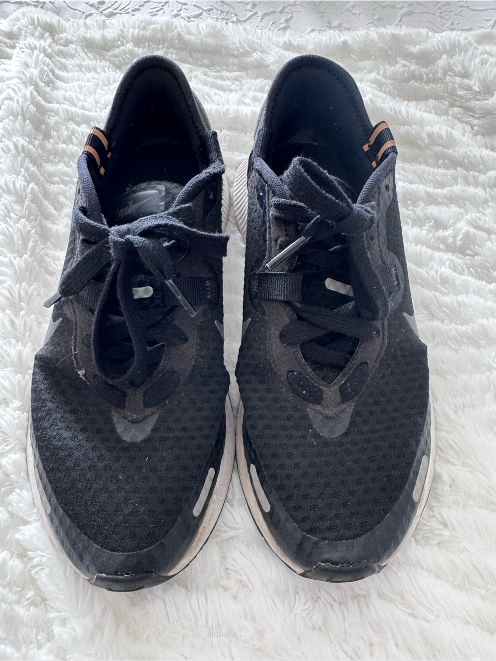 Nike Women's Black Athletic Shoes with Subtle Peach Accents